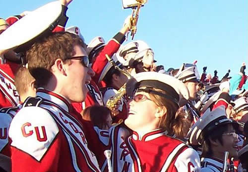 Nathan Olson '05 and Bri Bamford '07 turning each others' victory hats